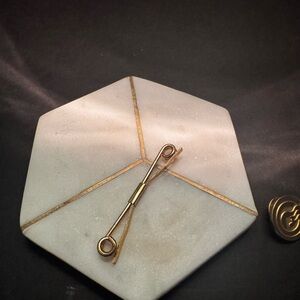 Stylish Gold Tie Clip on Marble Display